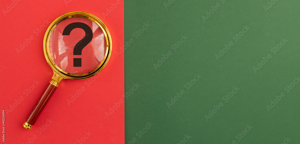 Poster question mark through magnifier on red and green banner. q and finding answers concept. background w
