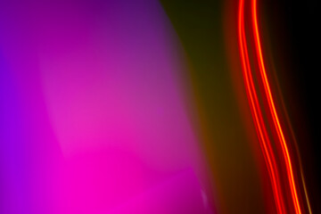 neon light motion on black. colorful abstract light background. shining light for decorating design as background and overlay to beautify a creative project.
