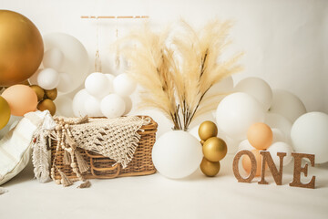 one year birthday studio setup with balloons and decorations