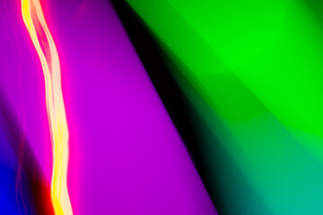 neon light motion on black. colorful abstract light background. shining light for decorating design as background and overlay to beautify a creative project.