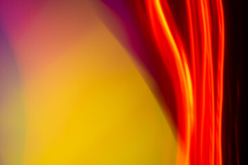 neon light motion on black. colorful abstract light background. shining light for decorating design as background and overlay to beautify a creative project.