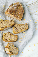 Delicious fresh baked bread on marble background. Healthy diet lifestyle.