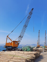 Fototapeta na wymiar Crane in pier in Hong Kong city