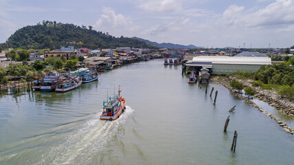 Fototapeta premium Pak Naam in Chumphon Thailand Drone Aerial UAV shot with skies and sea landscape with copy space