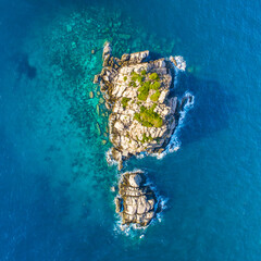 Shark Island off Koh Tao Thailand wide angle drone panorama deep blue ocean with island and long...