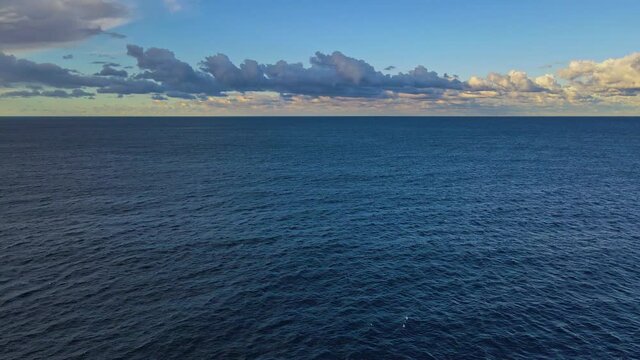 Beautiful deep blue ocean of Australia in sunset - panning left slow