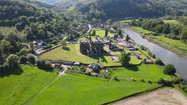 Tintern Abbey Monmouthshire on river Wye Wales UK Aerial footage.