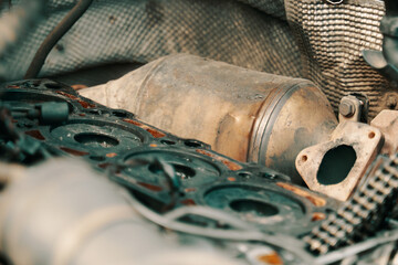 DPF . Diesel particulate filter under the hood near with a semi-disassembled engine. High quality photo