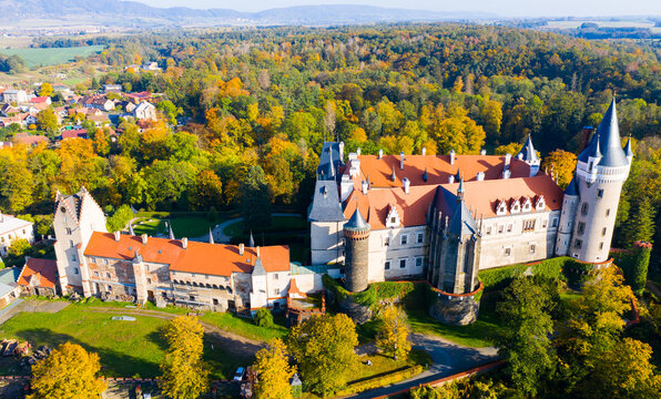 View from drone of autumn forest landscape overlooking ancient Zleby castle (Zamek Zleby), Central Bohemian Region, Czech Republic