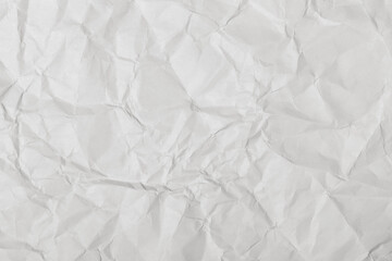 Crumpled white paper texture, close up.
