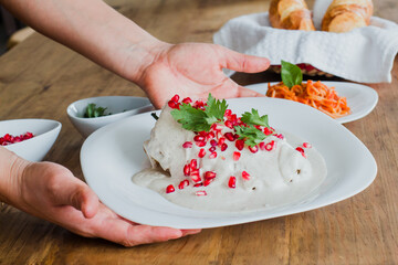 Chile en nogada hands cooking mexican food traditional from Puebla Mexico