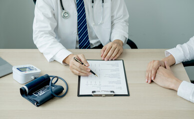 Man doctors who treat patients make an appointment to listen to the results after a physical...