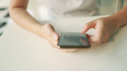 Woman holding Smartphone working mobile devices. cell telephone technology e-commerce concept.