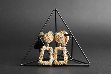 Composition with female jewelry on dark background