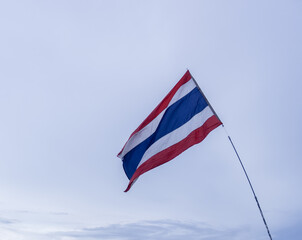 National flag of Thailand waving in cloudy sky