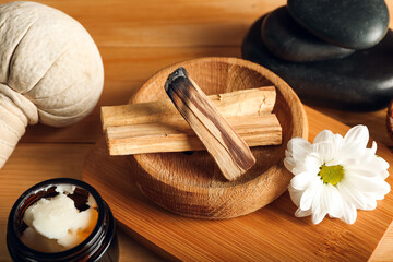Beautiful spa composition with Palo Santo on table