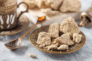 Greek (Turkish) brewed coffee and  halva on a table. Oriental sweetness