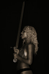 beautiful half-naked girl barbarian with a sword.  and chain mail on the bare chest