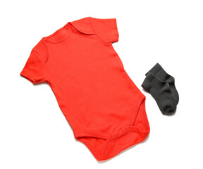 Baby clothes and socks on white background