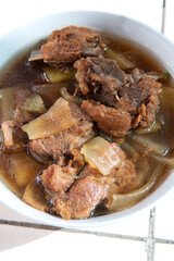A bowl of braised pork ribs wide vermicelli