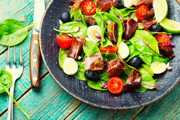 Spring salad with herbs and jerky