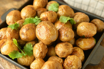 Tasty baked potato on table