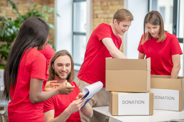 Group of student volunteers engaged in charity center