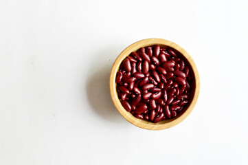 Top Views of Dried Kidney Beans in a wooden bowl isolated on white background, Full depth of field.
