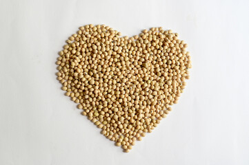 Top Views of Soybean in the shape of a heart isolated on the white background, Healthy Food Concept.