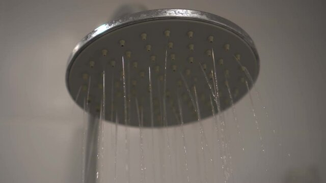 Footage B roll of Turning on and off the shower. Shower time in the bathroom.