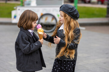 happy kids eating ice cream on the street