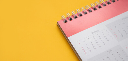 calendar page on yellow background business planning appointment meeting concept
