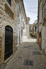 Bovino, Italy, June 23, 2021. A narrow street among the old houses of a medieval village in southern Italy.