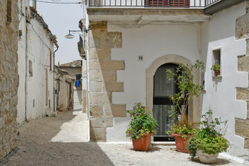 Fototapeta na wymiar Bovino, Italy, June 23, 2021. A narrow street among the old houses of a medieval village in southern Italy.