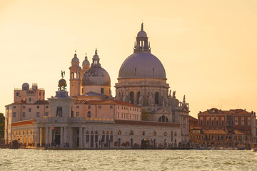 Basilica di Santa Maria della Salute and the ancient customs building of Punta della Dogana on a sunny September evening. Venice, Italy