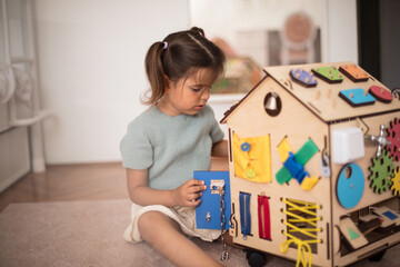 Toddler playing interactive games for good development at home.