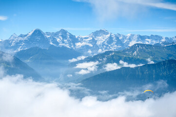 Fototapeta na wymiar paraglider in front of the impressive Bernese Alps