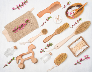 Fototapeta na wymiar Set of zero waste self care products with pink flowers on white background . Eco friendly personal care items tools cosmetics. Sustainable lifestyle concept.
