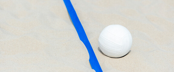 Beach volleyball ball on the sand beach. Team sport concept