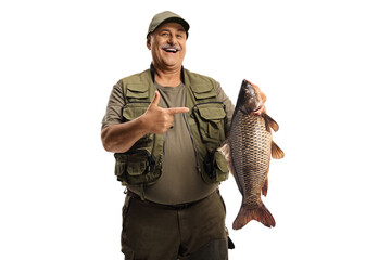 Mature fisherman holding a big carp fish and pointing