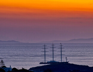 Sailboat At Sunset. Copy Paste.  Big sailnboat anchored outside Finikas Bay in Syros island, Greece. Stock Image.