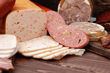 Variety of meat and sausage products on table