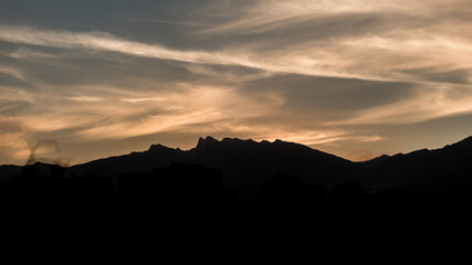 Cloudy sunset over mountains
