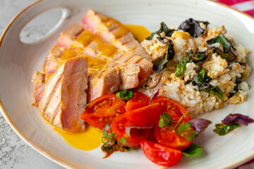 Grilled pork chop and rice with sauce