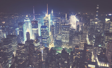 Aerial view of New York City at hazy night, color toned picture, USA.