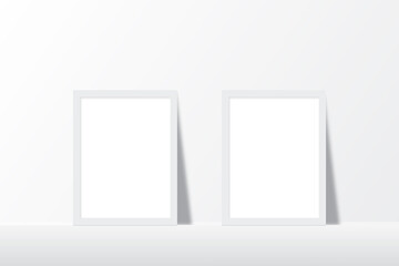 mockup of two clean white minimalist photo frames on the floor with shadow effect