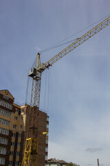 construction crane on sky background at construction site