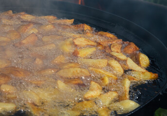 potatoes are fried in oil. Freshly cooked popular food. Side dish
