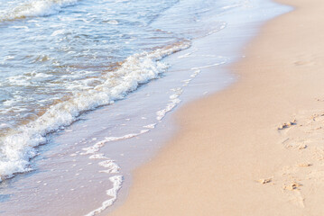 Soft wave of the sea on the sandy beach.Soft focus,blurred image.