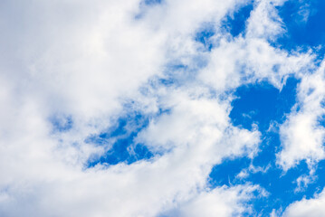 Fototapeta premium Dramatic blue sky with white clouds background.